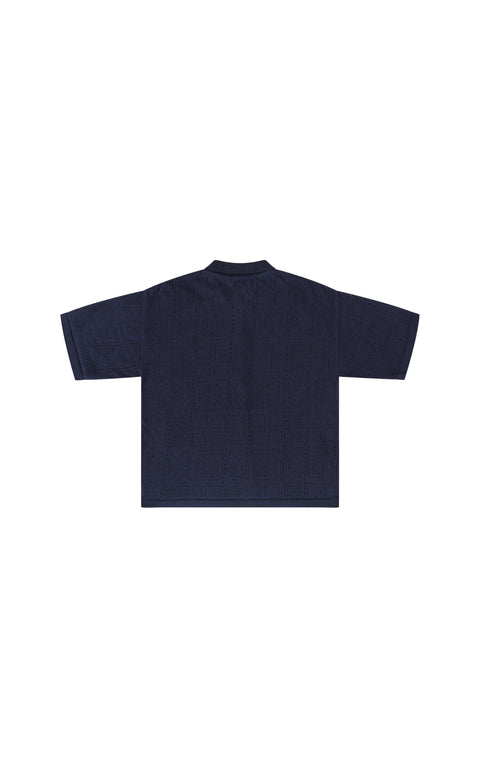 - Maglia a mezze maniche con chiusura a bottoni